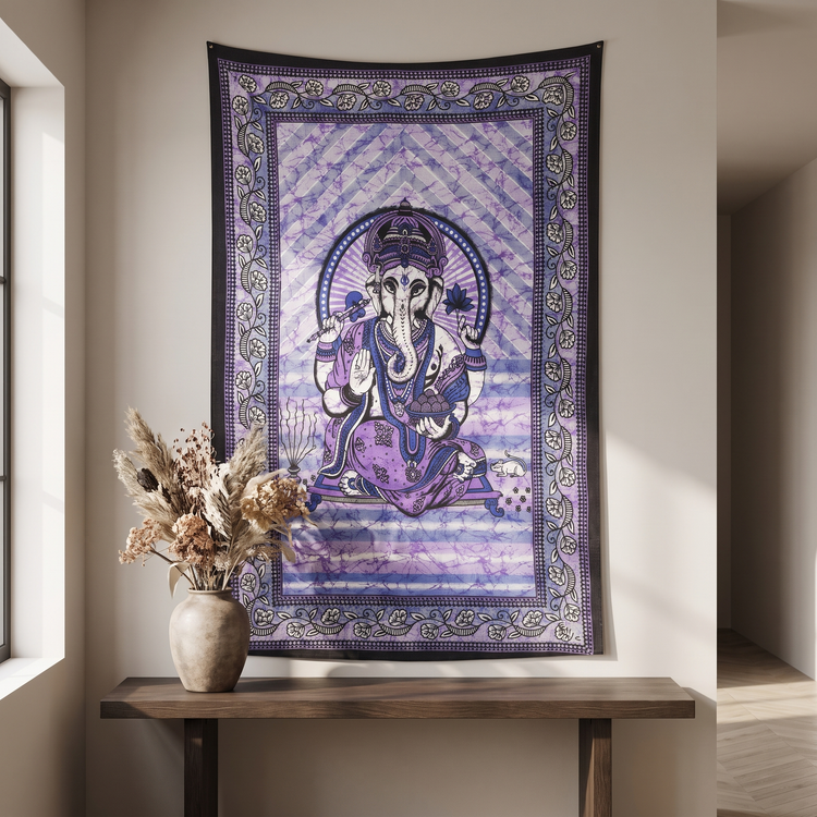 Close detail of the seated Ganesha figure on violet batik cotton